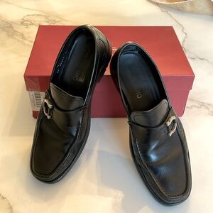 Salvatore Ferragamo's signature loafer with a thick lug sole alongside